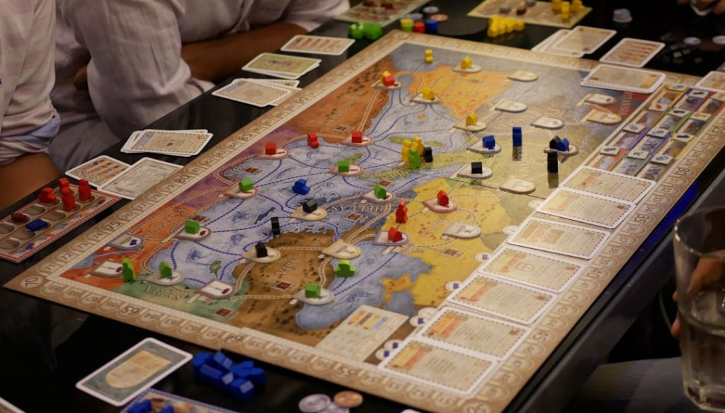 person-in-white-shirt-sitting-beside-table-with-puzzle-game-nrs53eukgie A game of Concordia